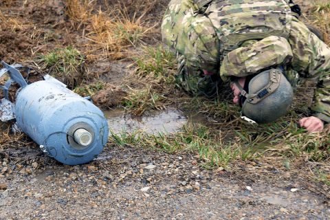 Sgt. Josh Wilson, an explosive ordnance disposal team leader with 49th Ordnance Company (Explosive Ordnance Disposal), 184th Ordnance Battalion (EOD), 52nd Ordnance Group (EOD), 20th Chemical, Biological, Radiological, Nuclear and high-yield Explosive Command, examines a simulated round for additional triggers on the training areas of Fort Campbell, Ky., Feb. 22, 2018. (U.S. Army photo by Staff Sgt. Adam Hinman) 