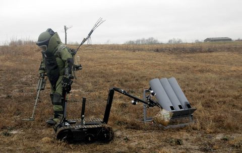 Staff Sgt. Jason McClure, an explosive ordnance disposal team leader with 717th Ordnance Company (Explosive Ordnance Disposal), 184th Ordnance Battalion (EOD), 52nd Ordnance Group (EOD), 20th Chemical, Biological, Radiological, Nuclear and high-yield Explosive Command, uses a metal detector near a simulated rocket firing position to check for additional threats on the training areas of Fort Campbell, Ky., Feb. 22, 2018.  (U.S. Army photo by Pvt. James Whitaker) 