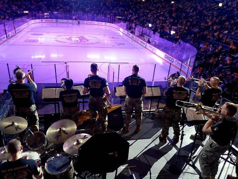 Members of the 101st Airborne Division Brass Band, perform during the New Jersey Devils vs Nashville Predators hockey game at Bridgestone Arena in Nashville March 10. The band was performing in support of the Predators Military Salute Week. (Capt. Jennifer Cruz, 40th Public Affairs Detachment)