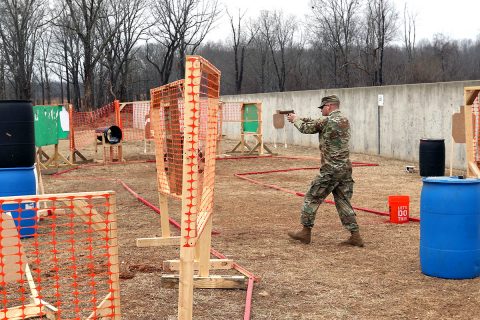 Captain Ryan Ulses, commander of Headquarters and Headquarters Company, 6th General Support Aviation Battalion, 101st Combat Aviation Brigade, 101st Airborne Division, recently navigates through an M17 pistol/M4 rifle range. The range was a timed competition during which firers engaged multiple targets from various firing points. (Staff Sgt. Todd Pouliot, 40th Public Affairs Detachment)