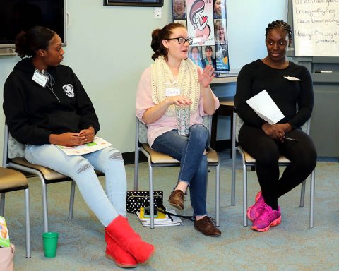 CenteringPregnancy participant Emily Allgood shares a story as Spc. Marissa Enabulele and Spc. Tonkalya Rogers listen during their Centering session March 22. Allgood and her Centering group all have July due dates. The women first meet monthly and as their pregnancies progress they meet every two weeks and then weekly at Blanchfield Army Community Hospital to share in their pregnancy journey. (U.S. Army photo by Maria Yager)