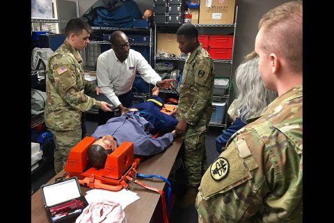 Nurse educator, Leroy Cantrell from Defense Medical Readiness Training Institute, Joint Base San Antonio, shows participants of the Trauma Nursing Core Course at Blanchfield Army Community Hospital how to use a pelvic sling. Cantrell traveled to Blanchfield March 5 to 9, to teach the TNCC and evaluate the hospital's TNCC program. (U.S. Army photo by Maria Yager) Nurse educator, Leroy Cantrell from Defense Medical Readiness Training Institute, Joint Base San Antonio, shows participants of the Trauma Nursing Core Course at Blanchfield Army Community Hospital how to use a pelvic sling. Cantrell traveled to Blanchfield March 5 to 9, to teach the TNCC and evaluate the hospital's TNCC program. (U.S. Army photo by Maria Yager)