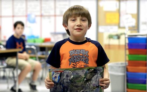 Clarksville-Montgomery County School System student showing artwork. 