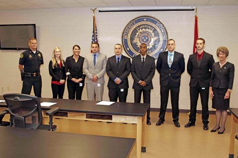 (L to R) CPD Chief Al Ansley, Alyssa Wade, Elizabeth Horton, Andy Gonzalez, Alan Greenman, Brandan Wells, Derek Meyer, and Donald Garrett Jr., and Clarksville Mayor Kim McMillan.