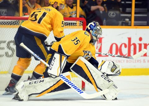 Nashville Predators goalie Pekka Rinne (35) watches as left wing Austin Watson (51) hits the puck out of the crease during the third period against the Winnipeg Jets at Bridgestone Arena. Mandatory Credit: Christopher Hanewinckel-USA TODAY Sports