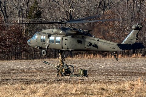 Artillerymen from B Battery, 3rd Battalion, 320th Field Artillery Regiment, 101st Airborne Division Artillery Brigade, 101st Airborne Division (Air Assault), rig an M119A3 howitzer to a UH-60 Black Hawk helicopter before conducting air assault operations, January 24, 2018, at Fort Campbell, Kentucky. Sling loading the howitzers allows the artillerymen to occupy remote locations more rapidly to effectively fire upon the enemy. (Spc. Patrick Kirby, 40th Public Affairs Detachment) Artillerymen from B Battery, 3rd Battalion, 320th Field Artillery Regiment, 101st Airborne Division Artillery Brigade, 101st Airborne Division (Air Assault), rig an M119A3 howitzer to a UH-60 Black Hawk helicopter before conducting air assault operations, January 24, 2018, at Fort Campbell, Kentucky. Sling loading the howitzers allows the artillerymen to occupy remote locations more rapidly to effectively fire upon the enemy. (Spc. Patrick Kirby, 40th Public Affairs Detachment)