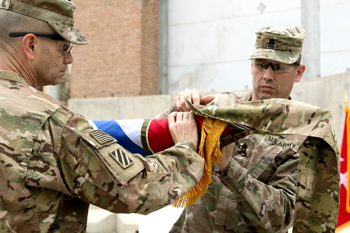 Maj. Gen. Leopoldo Quintas, former Resolute Support deputy chief of staff for operations and U.S. Forces-Afghanistan deputy commanding general for operations, and Command Sgt. Maj. Daniel Hendrix, his senior enlisted advisor, case the 3rd Infantry Division headquarters' colors, April 15, during a transfer of authority at Bagram Airfield, Afghanistan. (Staff Sgt. Lerone Simmons, U.S. Forces Afghanistan)