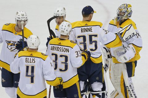 Apr 5, 2018; Washington, DC, USA; Nashville Predators goaltender Juuse Saros (74) celebrates with Predators goaltender Pekka Rinne (35) after their game against the Washington Capitals at Capital One Arena. The Predators won 4-3. Mandatory Credit: Geoff Burke-USA TODAY Sports