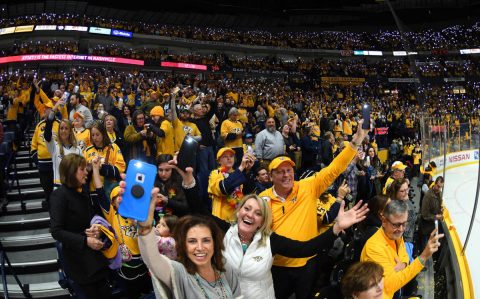 Nashville Predators fans wave cell phones and sing the Beatles \"Let It Be\" as referees review a goal late in the first period against the Columbus Blue Jackets at Bridgestone Arena. (Christopher Hanewinckel-USA TODAY Sports)