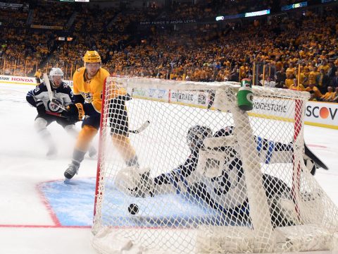 Nashville Predators left wing Kevin Fiala (22) scores the game winning goal against Winnipeg Jets goaltender Connor Hellebuyck (37) in second overtime in game two of the second round of the 2018 Stanley Cup Playoffs at Bridgestone Arena. (Christopher Hanewinckel-USA TODAY Sports)