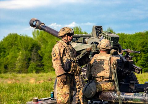 Staff Sgt. Ryan Wertenberger, Bravo Battery, 3rd Battalion, 320th Field Artillery Regiment, 101st Airborne Division Artillery Brigade, 101st Airborne Division, prepares his fire team to fire the M119A3 Howitzer 2 May during the unit’s Table XV gunnery at Fort Campbell, KY. (Sgt. Steven Lopez, 40th Public Affairs Detachment)