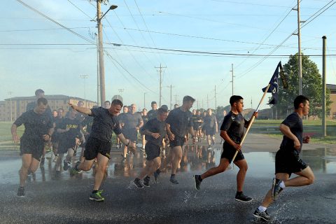 Soldiers from 101st Airborne Division, get sprayed by a hose as they run 4 miles in a division run for Week of the Eagles, May. 24 on Fort Campbell, Ky. Week of the Eagles was a tradition started in 1973 as an effort to reinvigorate the sense of community and is still carried on today to also honor those who served. (Sgt. Sharifa Newton, 40th Public Affairs Detachment) 