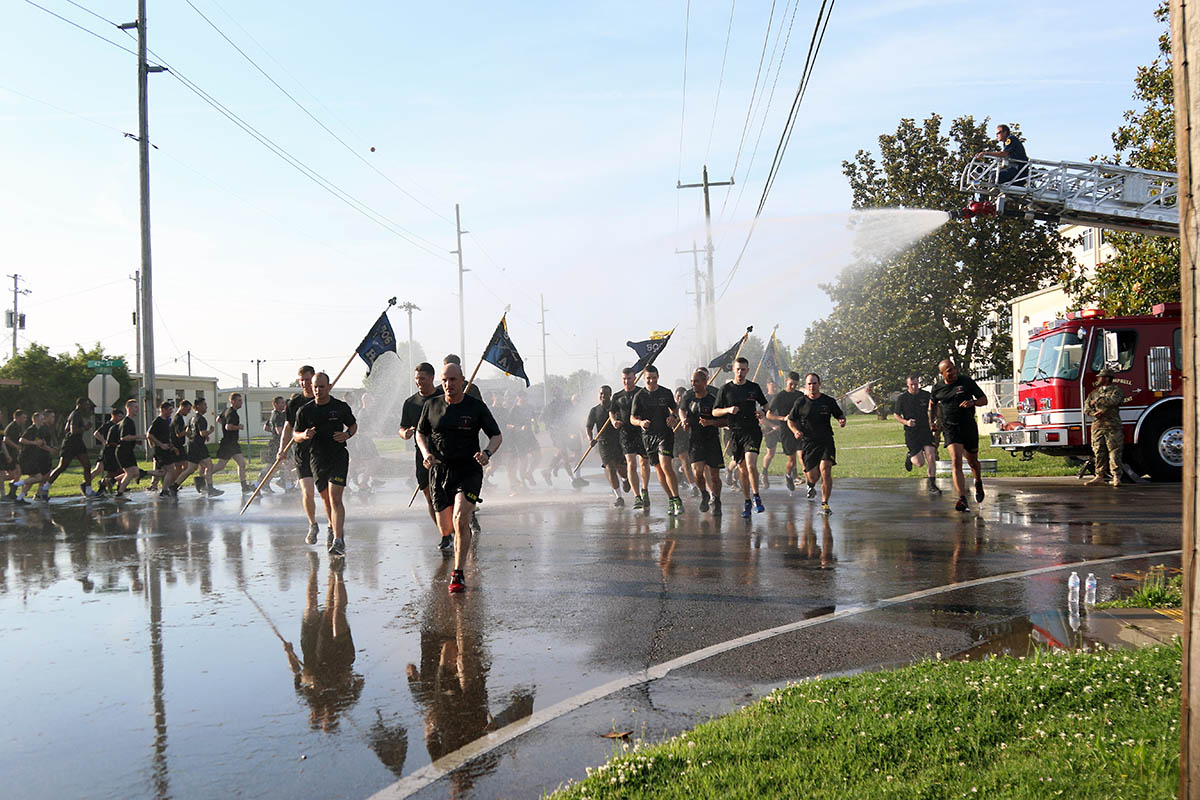 Soldiers from 101st Airborne Division, get sprayed by a hose as they run 4 miles in a division run for Week of the Eagles, May. 24 on Fort Campbell, Ky. Week of the Eagles was a tradition started in 1973 as an effort to reinvigorate the sense of community and is still carried on today to also honor those who served. (Sgt. Sharifa Newton, 40th Public Affairs Detachment)
