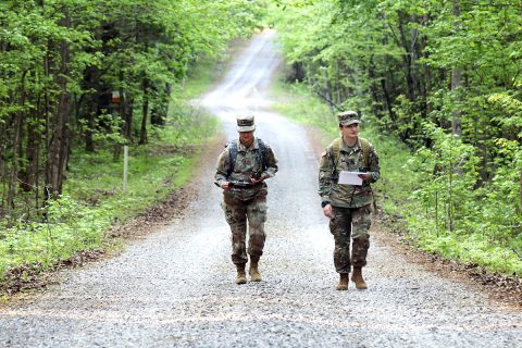 Pvt. Sheyla Ocampo, a combat medic specialist from 1-320th Field Artillery, and Spc. Lauren L. Barlow, a combat medic specialist from Headquarter and Headquarters Battery, both from 101st Division Artillery, 101st Airborne Division (Air Assault), find their way back to the main roads during an Expert Field Medical Badge land navigation training on Fort Campbell, KY, May 8th, 2018.  (Pfc. Beverly Roxane Mejia, 40th Public Affairs Detachment) 