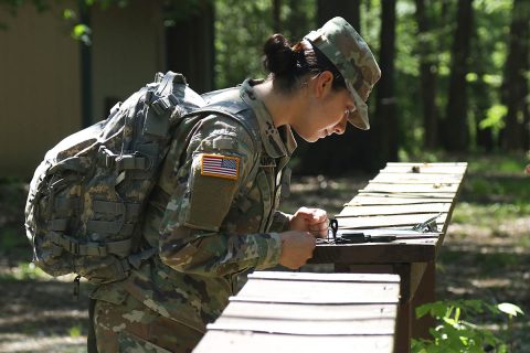 Pvt. Sheyla Ocampo, a combat medic specialist from 1-320th Field Artillery, 101st Division Artillery, 101st Airborne Division (Air Assault) calibrates her compass during an Expert Field Medical Badge land navigation training, May 8th, 2018, Fort Campbell, KY. The EFMB is awarded to Solders with proficient medical and tactical soldier skills. (Pfc. Beverly Roxane Mejia, 40th Public Affairs Detachment) 