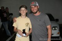 Dylan Byard (left) was the first place winner of Hilltop Supermarket’s 1st annual Country Kids Cook-Off. Cody Jackson (right) gave Byard his trophy and cash prize.