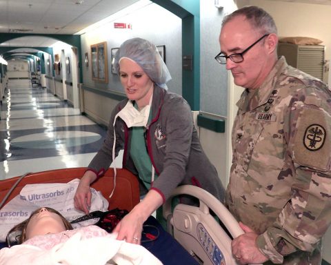 Blanchfield Army Community Hospital Labor and Delivery Nurse, Capt. Lindsay Miller demonstrates some of the features of the hospital's new obstetrics and pediatrics training simulator to hospital commander, Col. Anthony L. McQueen. (U.S. Army photo by Fred Holly)