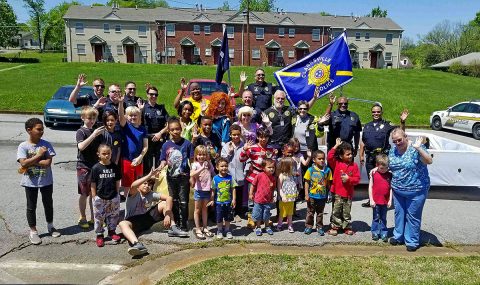 Clarksville Police Department Officers and Clergy Rapid Mobilization Team in Summit Heights preforming Community Outreach