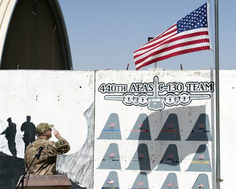 Col. Billy Pruett, Train, Advise, Assist Command-Air (TAAC-Air) command surgeon general, salutes in honor of Staff Sgt. Aaron Butler during a Memorial Day service May 28, 2018, Kabul, Afghanistan. Pruett read about how and when Butler fell and honored Butler’s sacrifice. (U.S. Air Force photo by Staff Sgt. Jared J. Duhon) 