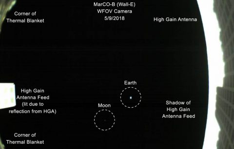 The first image captured by one of NASA's Mars Cube One (MarCO) CubeSats. The image, which shows both the CubeSat's unfolded high-gain antenna at right and the Earth and its moon in the center, was acquired by MarCO-B on May 9. (NASA/JPL-Caltech)