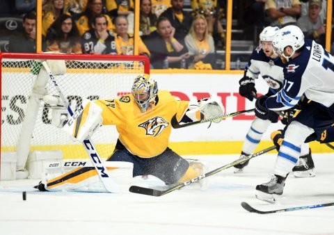 May 5, 2018; Nashville, TN, USA; Nashville Predators goalie Juuse Saros (74) makes a save on a shot by Winnipeg Jets center Adam Lowry (17) during the third period in game five of the second round of the 2018 Stanley Cup Playoffs at Bridgestone Arena. Mandatory Credit: Christopher Hanewinckel-USA TODAY Sports