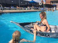 Merrol Hyde Magnet School senior Gracie Gumm discusses the boat with Signal Mountain Middle/High School senior Lili Swann.