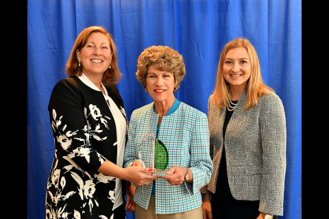 Susan Moulton, left, with Waste Management Inc., presented a City Livability Award to Clarksville Mayor Kim McMillan and Chief of Staff Heather Fleming during the U.S.Conference of Mayors annual conference Saturday.