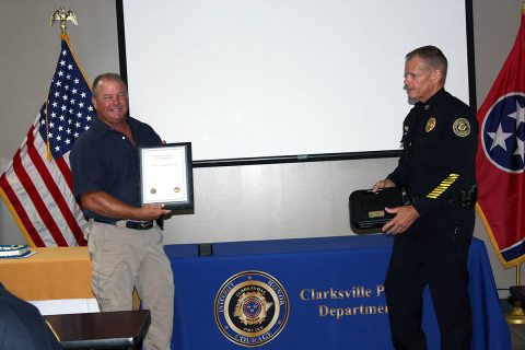 Clarksville Police Officer James Eure receives his Certificate of Retirement.