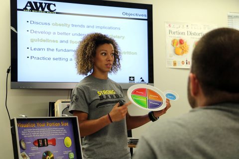 Jheri Weidensall, Fort Campbell Army Wellness Center program specialist talks to participants at a Fueling for Health Class about the variety and quantity of foods they should eat for optimal nutrition and wellness. The class is one of many wellness events offered free at the Army Wellness Center to Soldiers, retirees, family members and Department of the Army Civilians. (U.S. Army photo by Maria Yager)