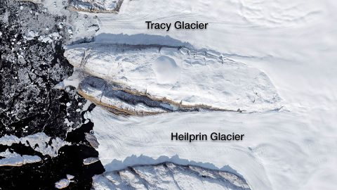 Tracy and Heilprin glaciers in northwest Greenland. The two glaciers flow into a fjord that appears black in this image. (NASA)