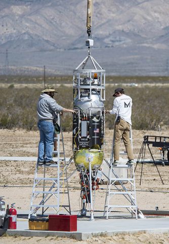 Masten Space Systems’ technicians prepare their Xodiac rocket to flight test Honeybee Robotics pneumatic sampler collection system, PlanetVac, in Mojave Desert. (NASA Photo / Lauren Hughes) Masten Space Systems’ technicians prepare their Xodiac rocket to flight test Honeybee Robotics pneumatic sampler collection system, PlanetVac, in Mojave Desert. (NASA Photo / Lauren Hughes)