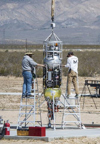 Masten Space Systems’ technicians prepare their Xodiac rocket to flight test Honeybee Robotics pneumatic sampler collection system, PlanetVac, in Mojave Desert. (NASA Photo / Lauren Hughes)