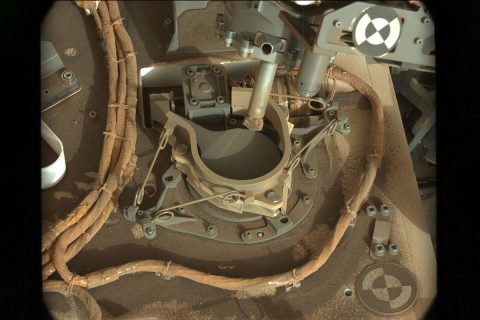 The drill bit of NASA's Curiosity Mars rover over one of the sample inlets on the rover's deck. The inlets lead to Curiosity's onboard laboratories. This image was taken on Sol 2068 by the rover's Mast Camera (Mastcam). (NASA/JPL-Caltech/MSSS)