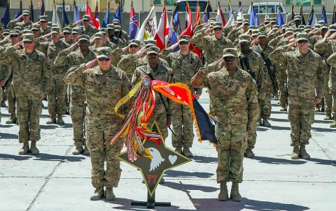 The brigade command team, consisting of Col. Stanley Sliwinski, commander of the 101st Airborne (Air Assault) Resolute Support Sustainment Brigade and Command Sgt. Maj. Anthony B. McAdoo, senior enlisted leader for the 101st Airborne Division (Air Assault) Resolute Support Sustainment Brigade, along with the rest of their formation and the soldiers of the 495th Combat Sustainment Support Battalion of the Montana National Guard, participate in the time-honored tradition of their brigade patching ceremony, July 11, 2018, in Bagram Airfield, Afghanistan. (Staff Sgt. Caitlyn Byrne, 101st Sustainment Brigade PAO) 