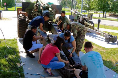 Soldiers of the 101st Airborne Division (Air Assault) clean a 155mm M114 howitzer, 29 June, at the Don F. Pratt Memorial Museum on Fort Campbell, Kentucky. (Pfc. Lynnwood Thomas, 40th Public Affairs Detachment)