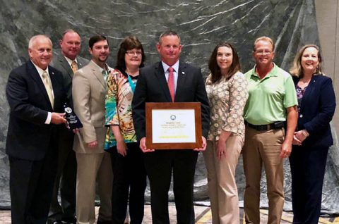 (L to R) Tennessee Deputy Governor Jim Henry, County Chief of Staff Jeff Truitt, County Engineer Nick Powell, County Administrative Assistant Emily Mathews, Montgomery County Mayor Jim Durrett, CMC Green Certification Manager Carlye Sommers, County Facilities Manager Kenneth Gentry and TDEC Commissioner Shari Meghreblian.