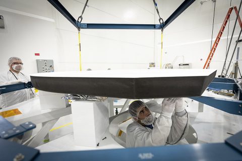 Parker Solar Probe’s heat shield is made of two panels of superheated carbon-carbon composite sandwiching a lightweight 4.5-inch-thick carbon foam core. To reflect as much of the Sun’s energy away from the spacecraft as possible, the Sun-facing side of the heat shield is also sprayed with a specially formulated white coating. (NASA/Johns Hopkins APL/Ed Whitman)