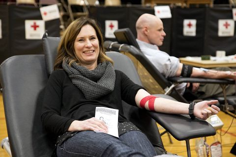 Heidi Reed relaxes in a donor chair following her blood donation. Reed’s mother received blood during a surgery. (Amanda Romney/American Red Cross)