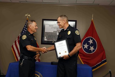 Retiring Clarksville Police Department Deputy Chief Charles F. Gray (left) shakes hands with Chief of Police Al Ansley (right).