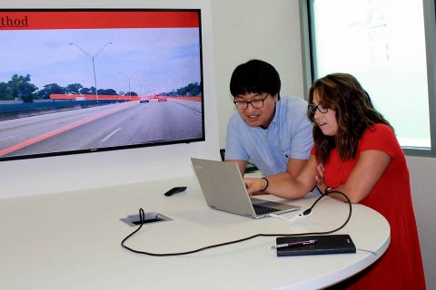 APSU senior Jordan Miller shows her program to Florida Atlantic University mentor Dr. Jinwoo Jang during her summer undergraduate research project. Miller researched a self-driving car program to help identify and report missing or incomplete lanes on roads. APSU senior Jordan Miller shows her program to Florida Atlantic University mentor Dr. Jinwoo Jang during her summer undergraduate research project. Miller researched a self-driving car program to help identify and report missing or incomplete lanes on roads.