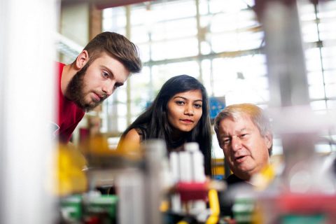 Joshua Schlensker and Ushma Patel, both of Clarksville, and APSU lab technician Timothy Daniel examine the new mechatronics equipment.