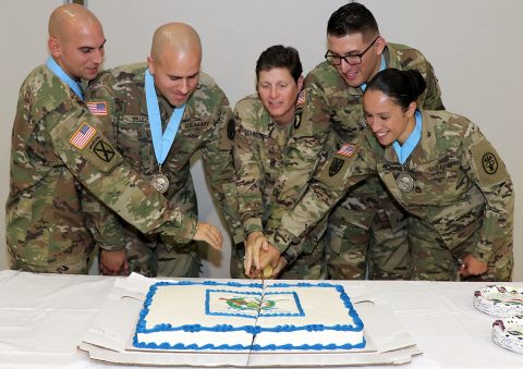 Command Sgt. Maj. Michele Johnson, (center) assigned to the 531st Field Hospital Center, cuts the celebratory cake, Sept. 7, with newly inducted Sgt. Audie Murphy Club members (left to right) Sgt. 1st Class James Rowland, 101st Airborne Division Artillery Brigade, Staff Sgt. Javier Velez, Fort Campbell Dental Health Activity, Sgt. 1st Class Gregory Rios and Sgt. 1st Class Victoria Romero, both assigned to Blanchfield Army Community Hospital. (U.S. Army photo by Maria Yager)