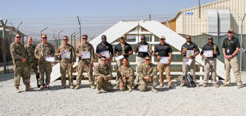 Contractors, Soldiers and Department of the Army Civilians congratulate contestants of the K9 Competition that occurred here on Bagram Airfield, Afghanistan. The K9 competition, held September 16, 2018, consisted of four events: detection, obedience, agility and controlled aggression. In each event, the working dog teams were evaluated on their expedience to complete the task, their accuracy, their focus and their obedience to their handler’s commands. (Staff Sgt. Caitlyn Byrne, 101st Sustainment Brigade Public Affairs) 