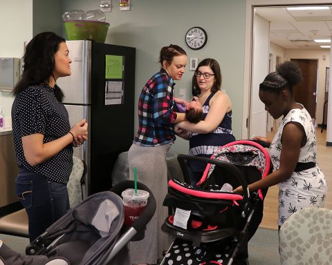 BACH Centering Pregnancy participants meet September 6th  to show off their babies and share their birth stories during a Centering Pregnancy reunion. Centering Pregnancy is a prenatal care method that combines traditional one-on-one health assessments, interactive learning and community support. Spouses and partners may also attend the group sessions to learn and offer support as pregnant women connect and learn about pregnancy, labor and delivery and life with a new baby. (U.S. Army photo by Maria Yager)