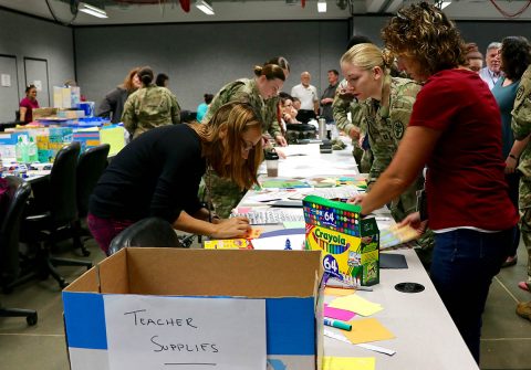 Team members from Blanchfield Army Community Hospital's Department of Behavioral Health donated school supplies and wrote notes of appreciation for local teachers during a command function. The notes and supplies were delivered Sept. 6 to the Clarksville-Montgomery County Education Foundation Teacher Warehouse, which allows local teachers to get limited free supplies for their classroom. (Maria Yager)