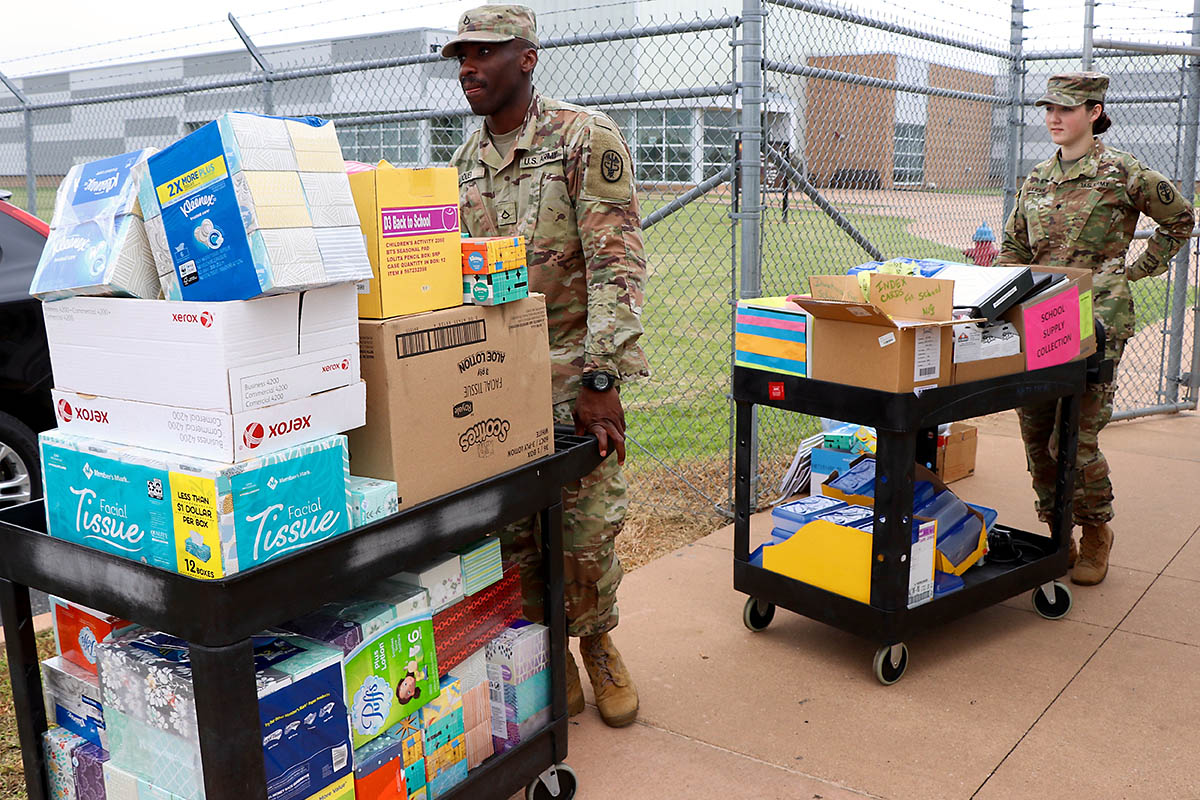 Behavioral Health Technicians, Spc. Maci Alleyne and Pfc. Mondeka Doui, assigned to Blanchfield Army Community Hospital Department of Behavioral Health prepare to load school supplies for delivery. Team members from the department donated school supplies and wrote notes of appreciation for local teachers during a command function. The notes and supplies were delivered Sept. 6 to the Clarksville-Montgomery County Education Foundation Teacher Warehouse, which allows local teachers to get limited free supplies for their classroom. (Maria Yager)