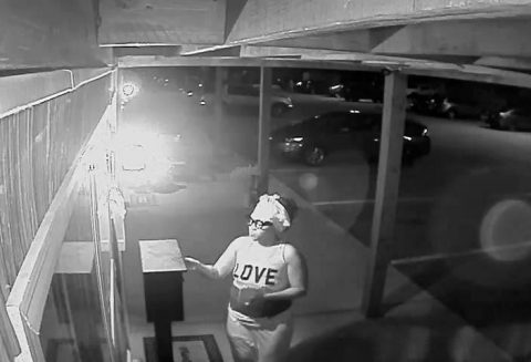 Woman in this photo can be seen breaking into the Money Drop Box.