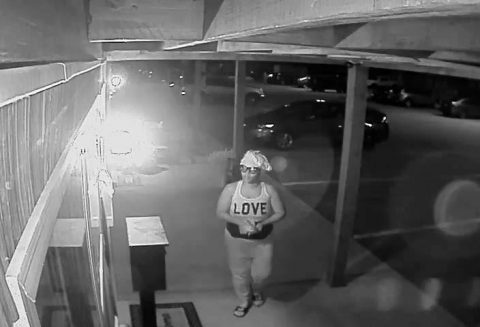 Woman in this photo can be seen breaking into the Money Drop Box.