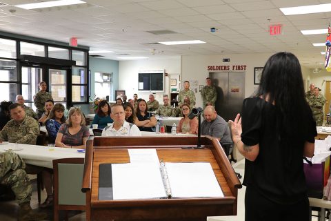 Fellow Gold Star Family Members and WTB staff listen as Gold Star Family Member and guest speaker Dusty Flynn shares her story of loss and grieving. Flynn spoke at a Gold Star breakfast and garden rededication ceremony at the Fort Campbell Warrior Transition Battalion Sept. 13. (U.S. Army photo by Maria Yager)