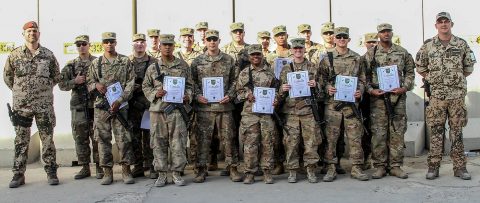 Soldiers of the 101st Resolute Support Sustainment Brigade proudly hold up their certificates of achievement after being recognized in an award ceremony for earning their German proficiency marksmanship badge on Bagram Airfield, Afghanistan, September 14th, 2018. (Spc. Alexes Anderson, 101st Airborne Division (AA) Sustainment Brigade Public Affairs)